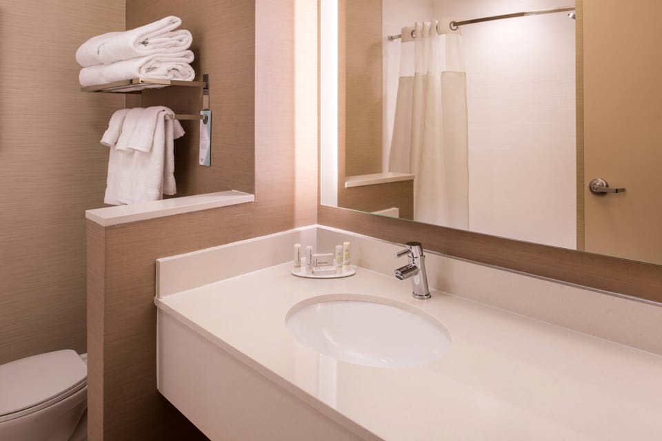 Designer toiletries, hair dryer, towels, soap