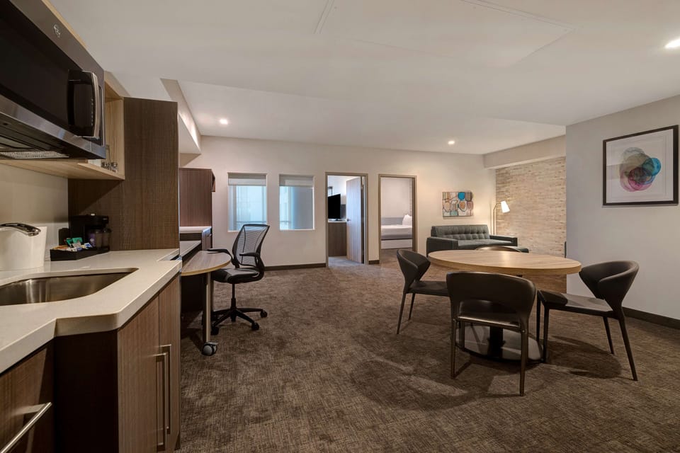 Suite, 2 Bedrooms, Non Smoking | Living area | 50-inch flat-screen TV with cable channels, TV