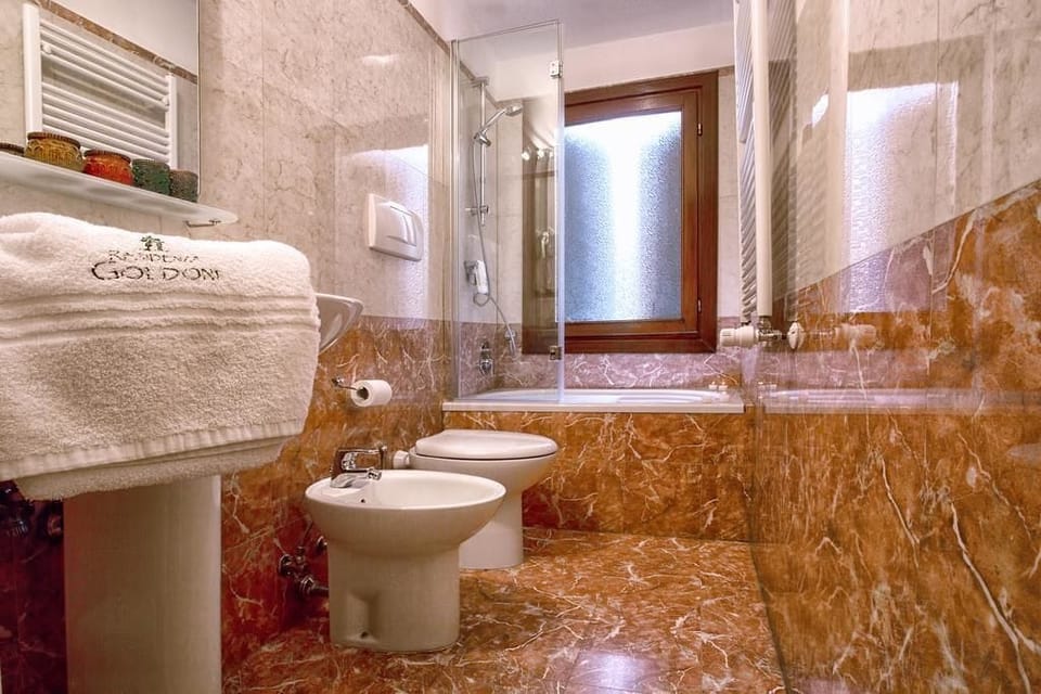 Separate tub and shower, free toiletries, hair dryer, towels