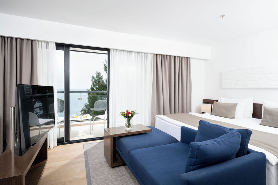 Premium Room, Balcony, Sea View | Minibar, in-room safe, desk, blackout drapes