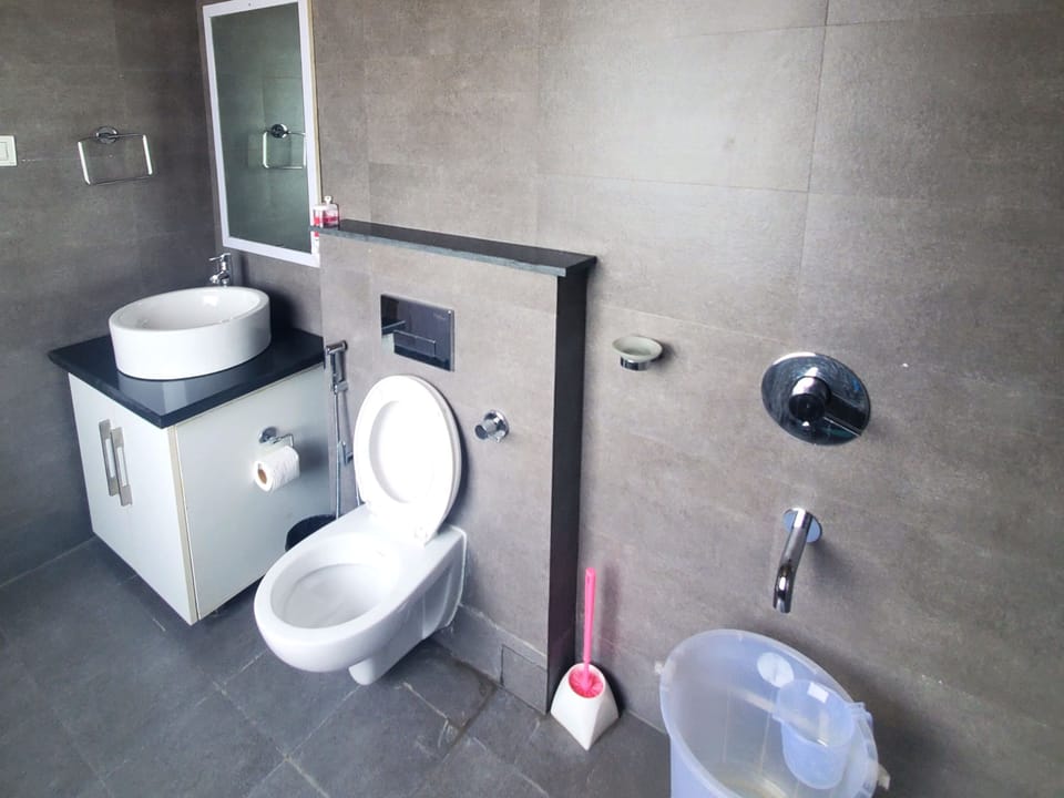 BROWN VILLA WITH A BIG PRIVATE SIT-OUT | Bathroom | Rainfall showerhead, free toiletries, bathrobes, bidet