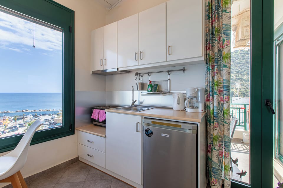 Apartment, 2 Bedrooms, Sea View | Private kitchen | Fridge, coffee/tea maker, electric kettle