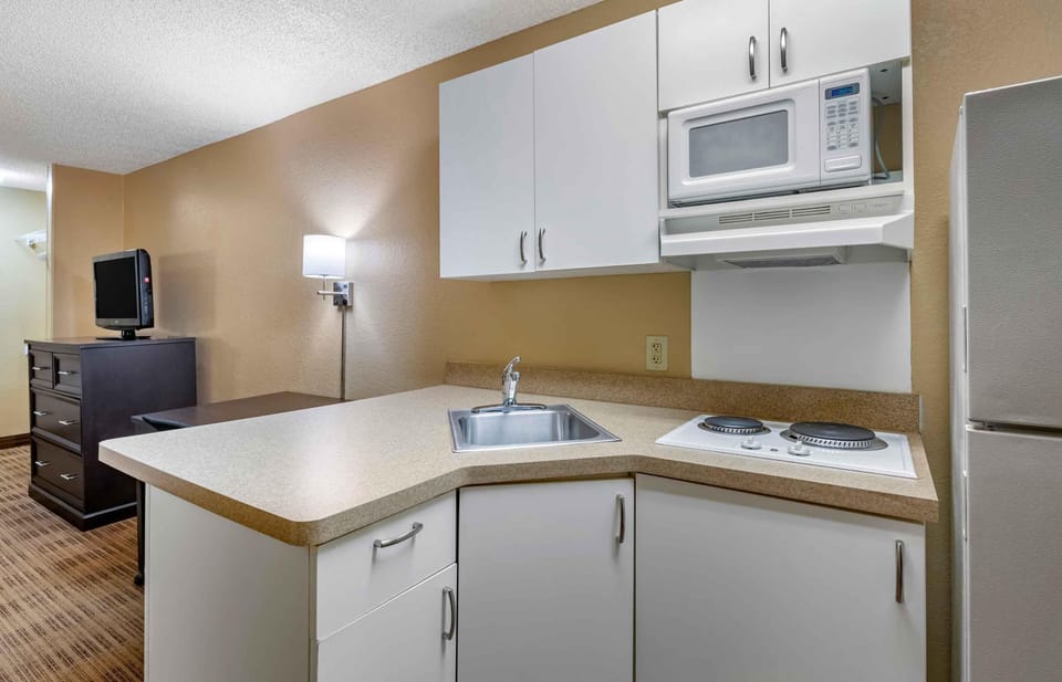 Studio, 1 King Bed, Non Smoking | Private kitchen | Full-size fridge, microwave, stovetop, coffee/tea maker
