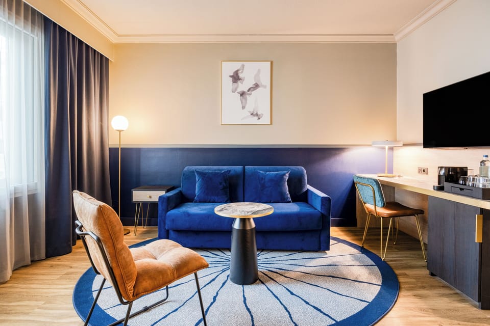 Premium Room, 1 King Bed with Sofa bed | Living area | Flat-screen TV