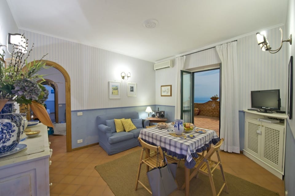 Apartment, 1 Bedroom | Living area | Flat-screen TV
