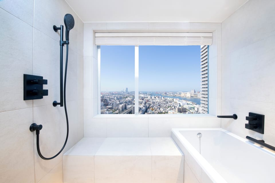 Combined shower/tub, free toiletries, hair dryer, slippers