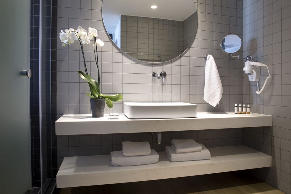 Shower, free toiletries, hair dryer, slippers