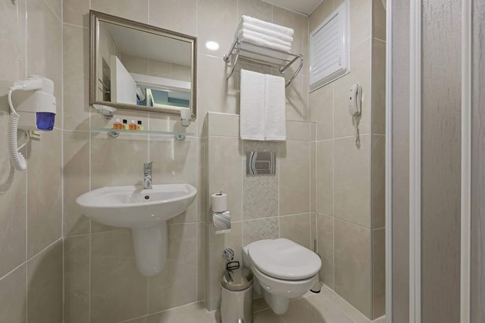 Shower, free toiletries, hair dryer, slippers