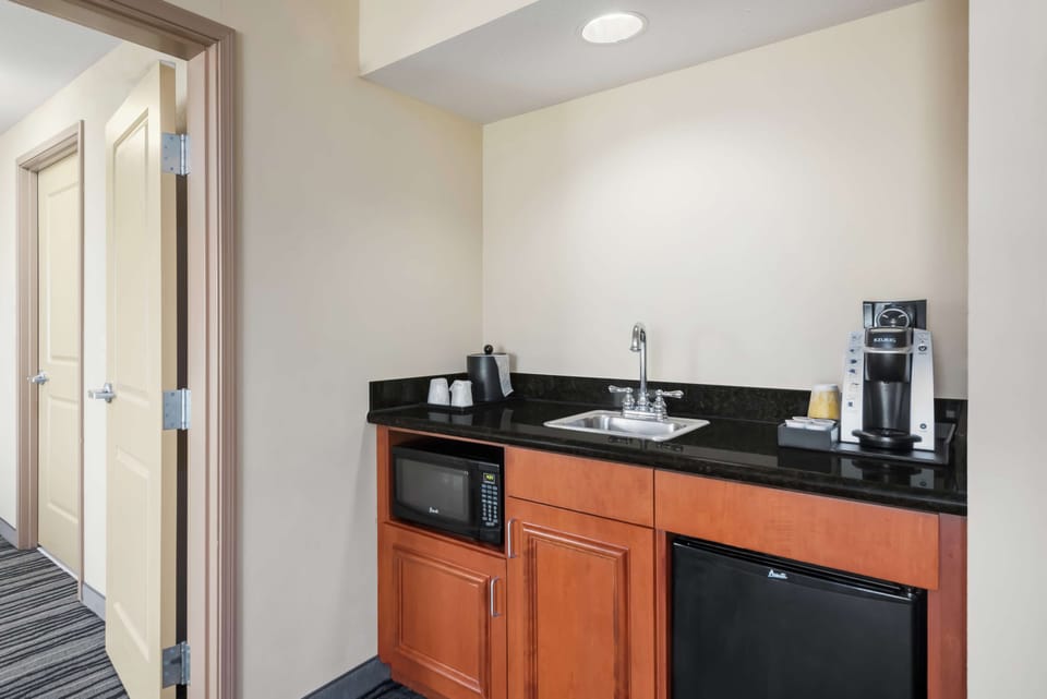 Two Bedroom Suite, 1 King Bed, Sofabed, Whirlpool | Down comforters, pillowtop beds, in-room safe, desk