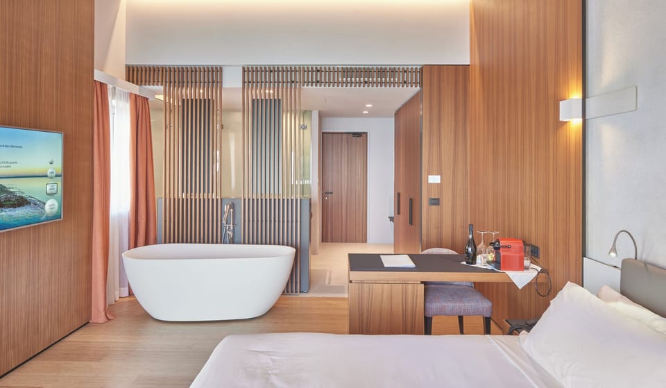 Junior Studio Suite, Lake View | Minibar, in-room safe, desk, laptop workspace