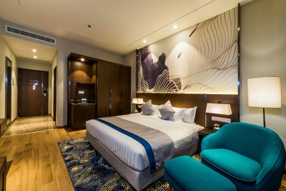 Deluxe Room, 1 Bedroom | Minibar, in-room safe, iron/ironing board, free WiFi