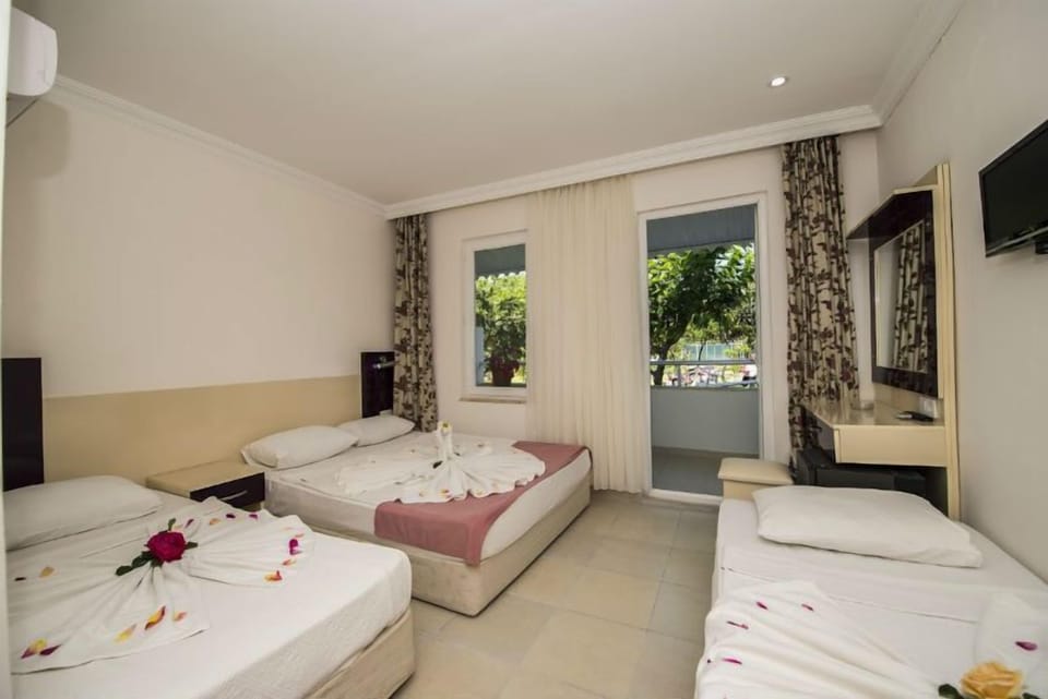 Standard Quadruple Room, Multiple Beds, Pool View | In-room safe