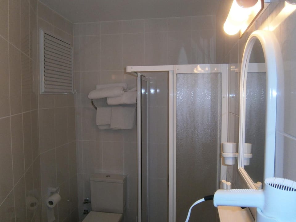 Shower, free toiletries, hair dryer, slippers