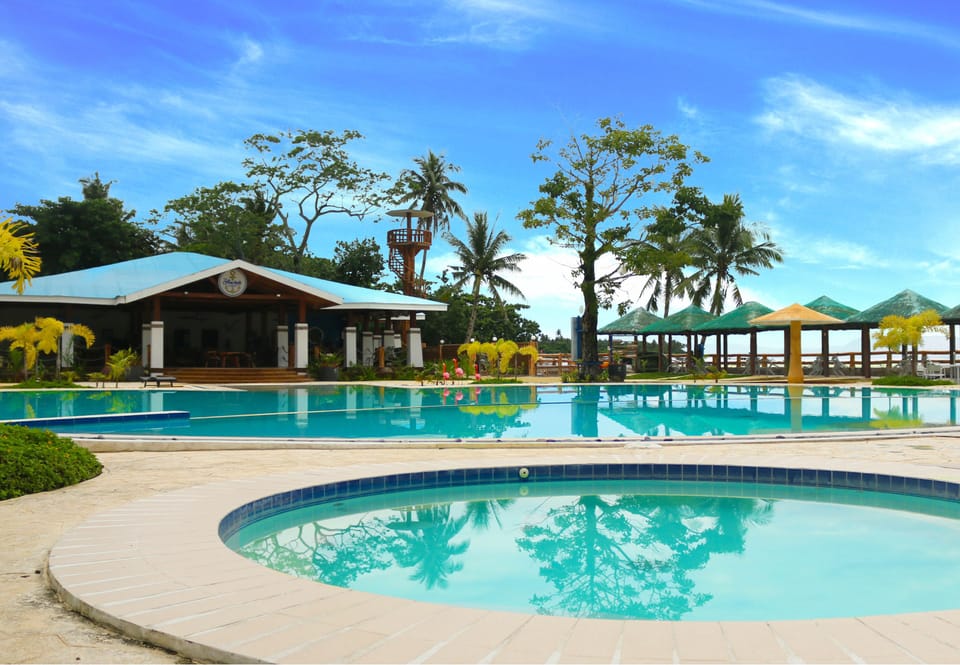 Outdoor pool, open 8 AM to 10 PM, pool umbrellas, sun loungers