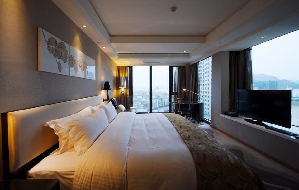 Deluxe Double Room, River View | Minibar, in-room safe, desk, laptop workspace