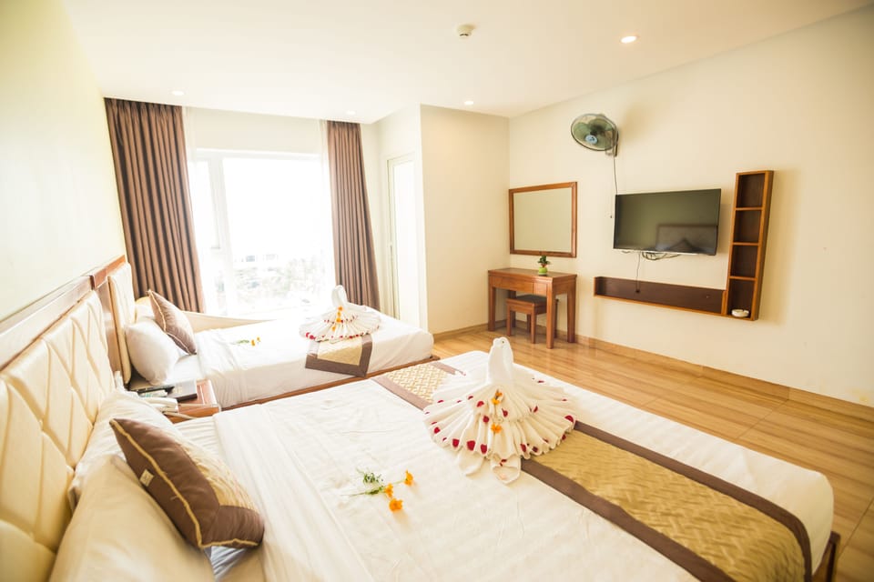Deluxe Quadruple Room, 1 Bedroom, Non Smoking | Minibar (free items), in-room safe, desk, blackout drapes