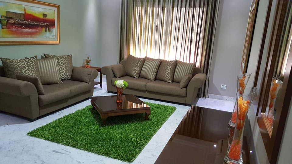 Apartment, 1 Bedroom | Living room | 40-inch flat-screen TV with satellite channels, TV