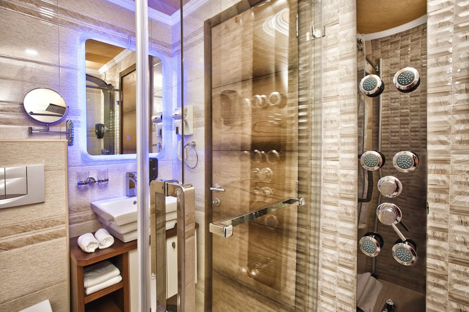 Suite, Balcony | Bathroom | Free toiletries, slippers, towels