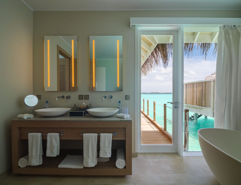 Separate tub and shower, free toiletries, hair dryer, slippers