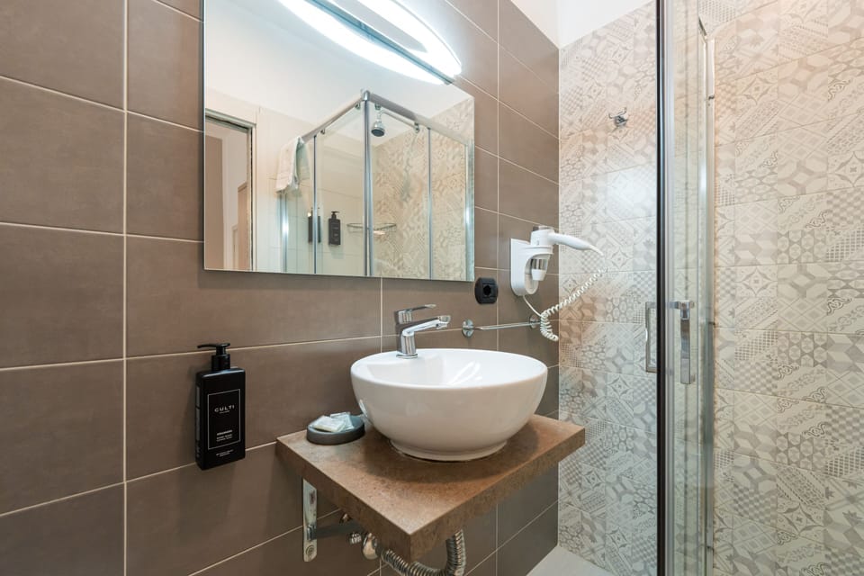 Designer toiletries, hair dryer, towels, soap