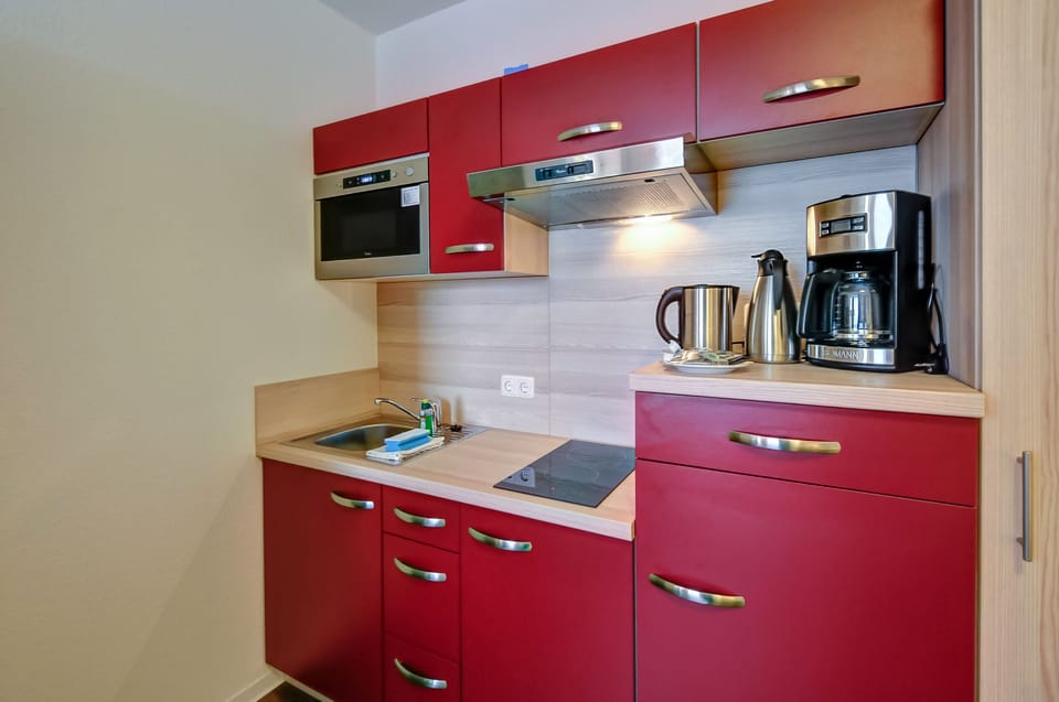Fridge, microwave, stovetop, coffee/tea maker