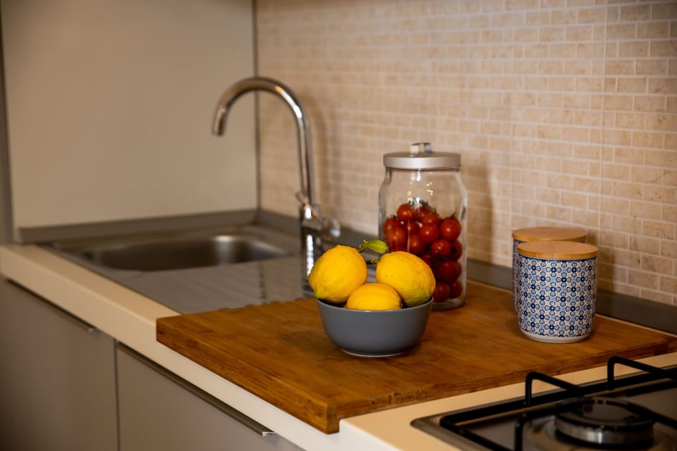 Family Apartment, 1 Bedroom | Private kitchen | Fridge, highchair