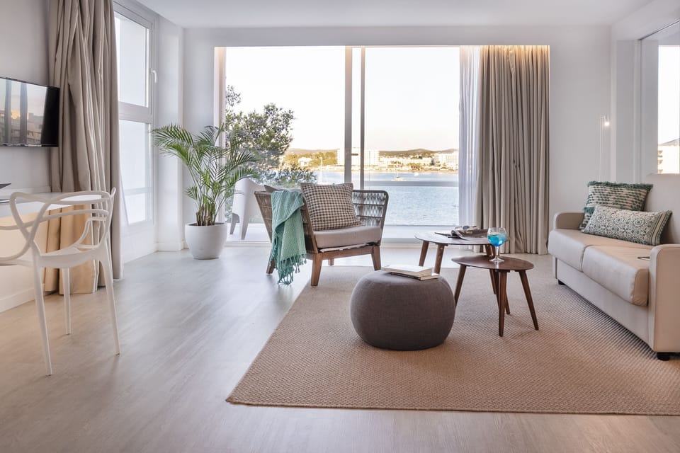 Suite, Balcony, Sea View | Minibar, in-room safe, desk, laptop workspace
