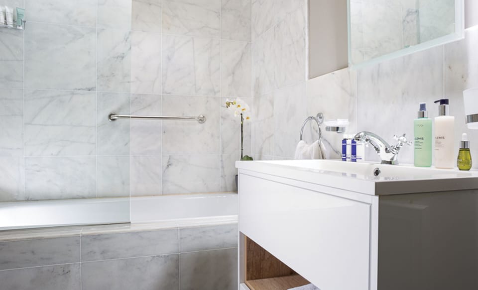 Shower, rainfall showerhead, designer toiletries, hair dryer