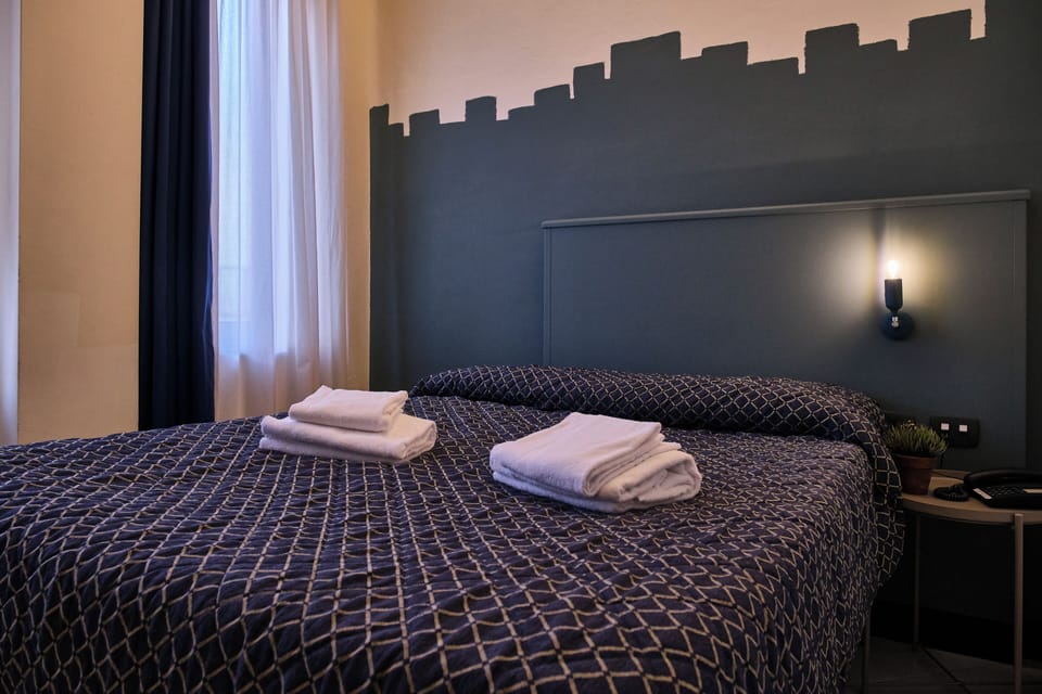 Family Quadruple Room | In-room safe, desk, laptop workspace, blackout drapes