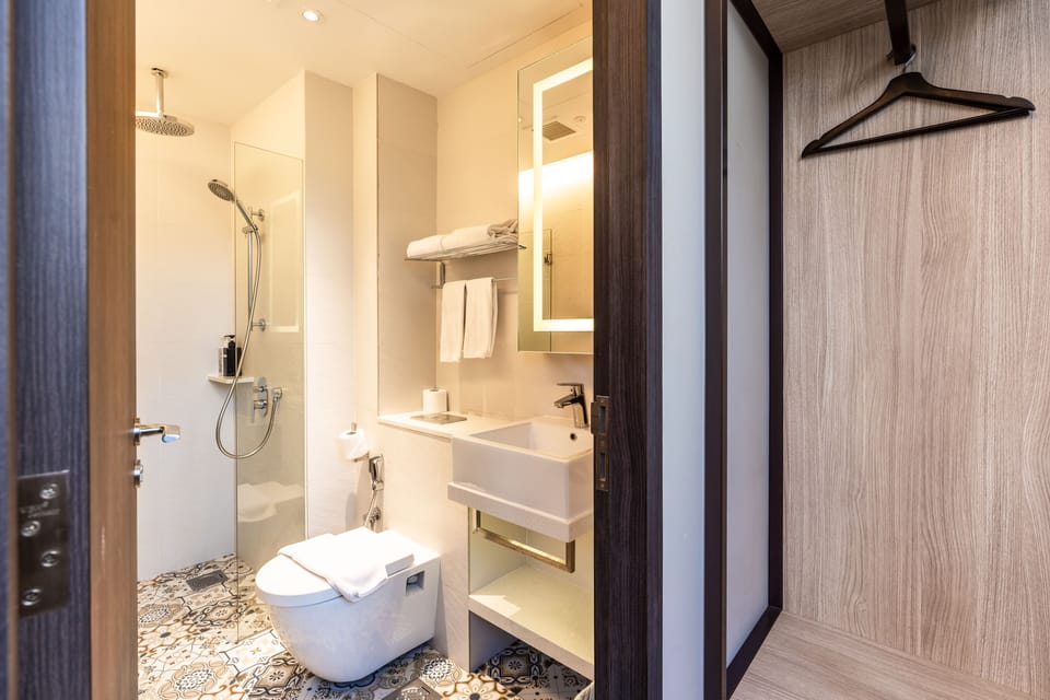 Shower, free toiletries, hair dryer, slippers