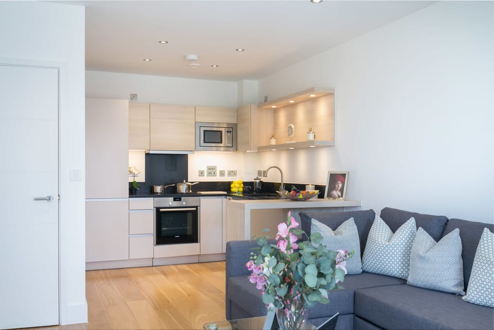 Deluxe One Bedroom Apartment with Balcony | Living area | Flat-screen TV