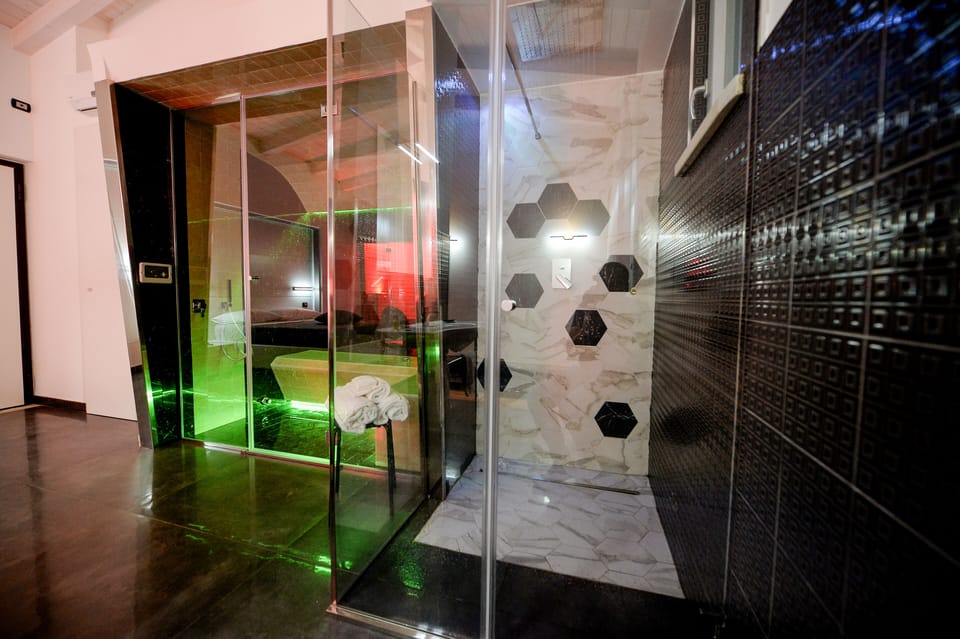 Luxury Suite, Sauna | Bathroom | Shower, hair dryer, bathrobes, slippers