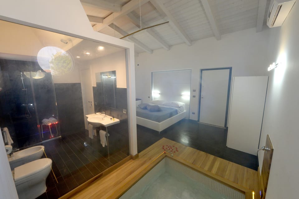 Superior Suite, Bathtub | Bathroom | Shower, hair dryer, bathrobes, slippers
