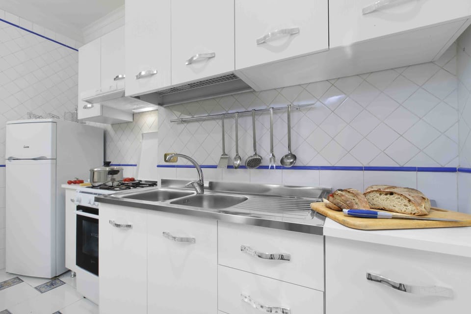 Apartment, 2 Bedrooms | Private kitchen | Fridge, microwave, stovetop, coffee/tea maker