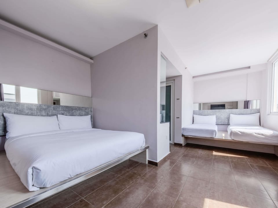 Deluxe Double Room, Multiple Beds | Desk, iron/ironing board (on request), WiFi (free), bed sheets
