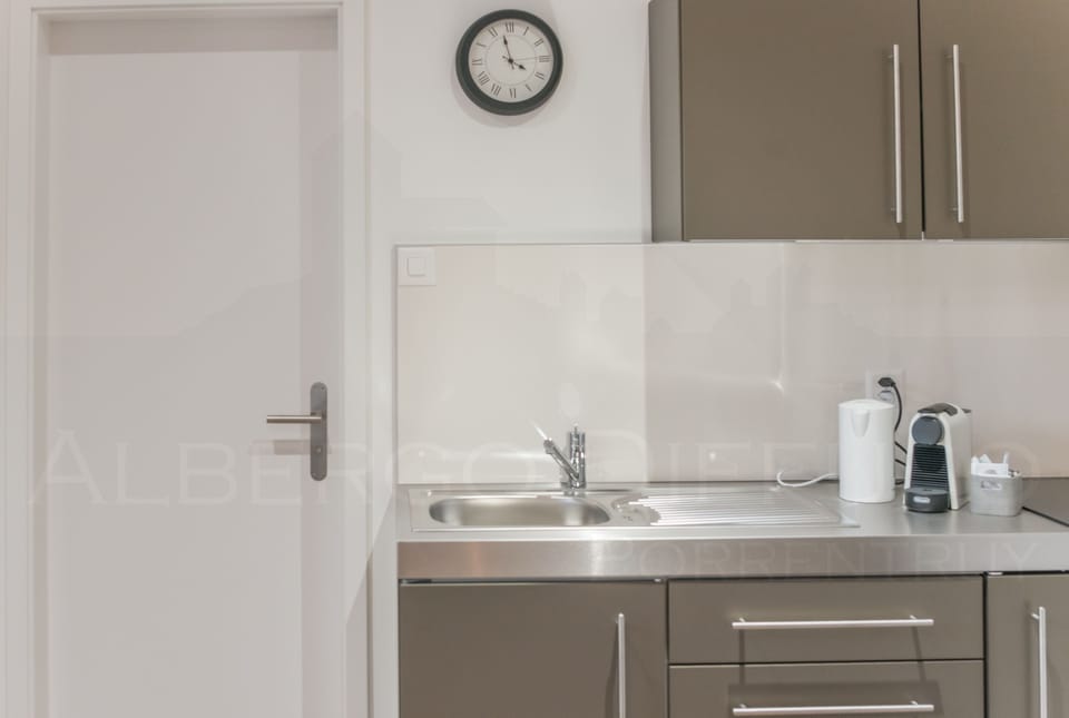 Fridge, coffee/tea maker, electric kettle, cleaning supplies