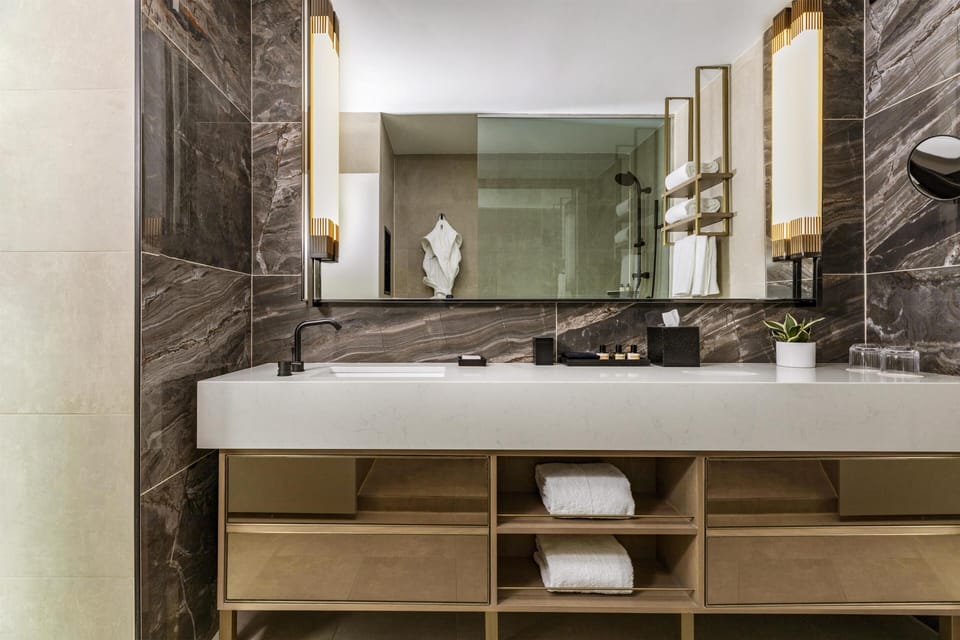 Designer toiletries, hair dryer, bathrobes, towels