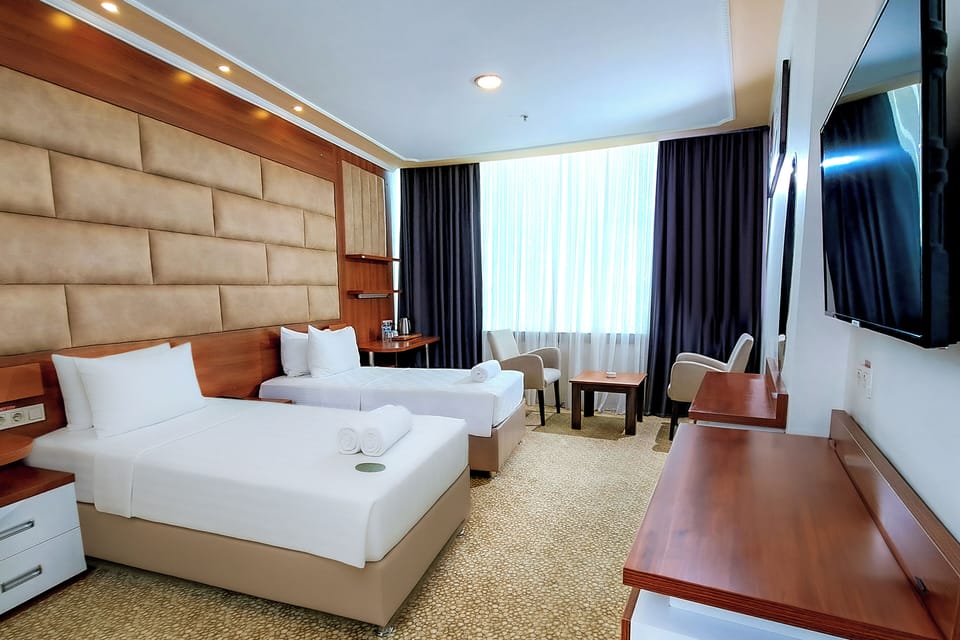 Standard Twin Room, 2 Twin Beds | Minibar, in-room safe, desk, laptop workspace