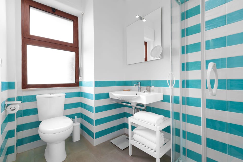 Deluxe Double Room, Terrace, Sea View | Bathroom | Shower, rainfall showerhead, free toiletries, hair dryer