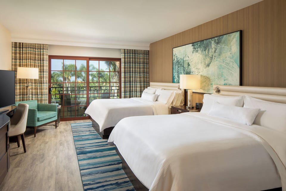 Deluxe Room, Multiple Beds, Balcony | Premium bedding, in-room safe, desk, laptop workspace