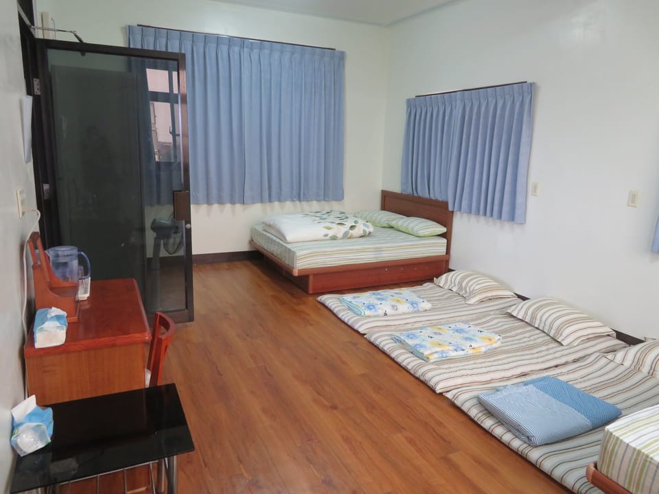 8 People Room, Shared Bathroom | Desk, laptop workspace, blackout drapes, rollaway beds