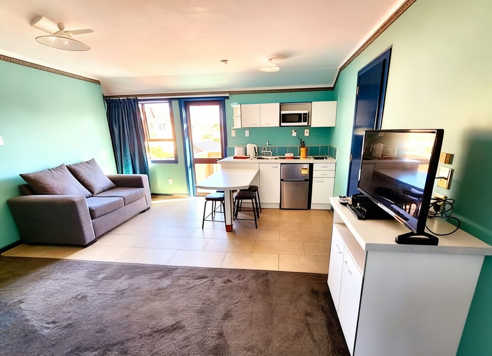Family Suite, Multi-space, Garden View | Living area | 43-inch flat-screen TV with cable channels, TV