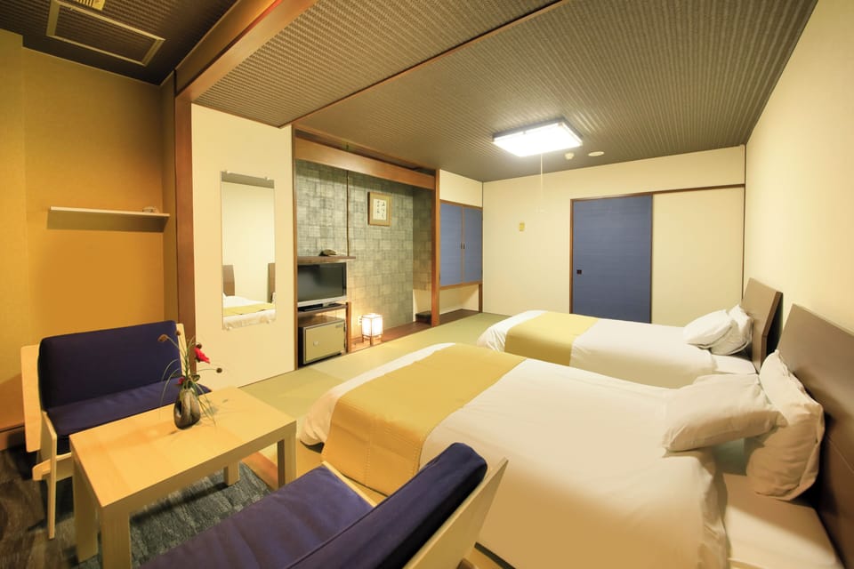 Japanese-style Twin Room, Non Smoking (2 beds) | Down comforters, in-room safe, desk, free WiFi