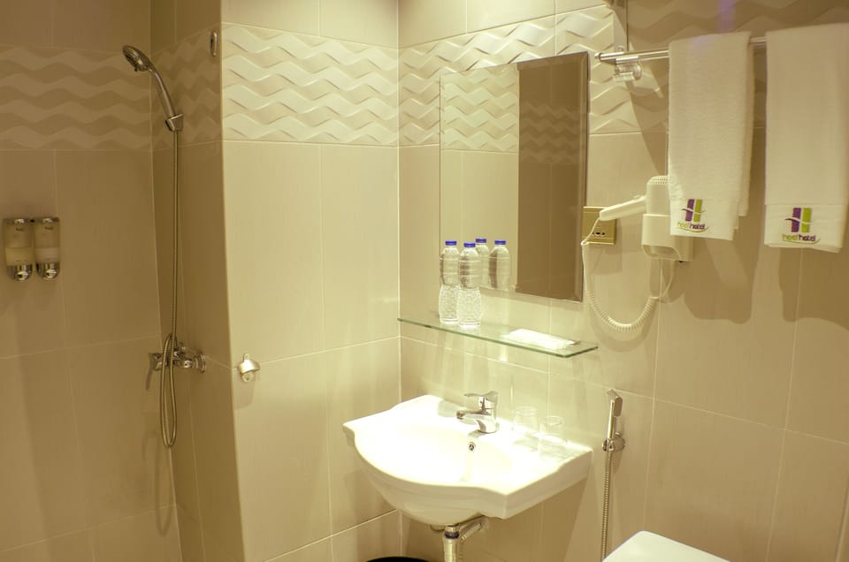 Shower, free toiletries, hair dryer, slippers