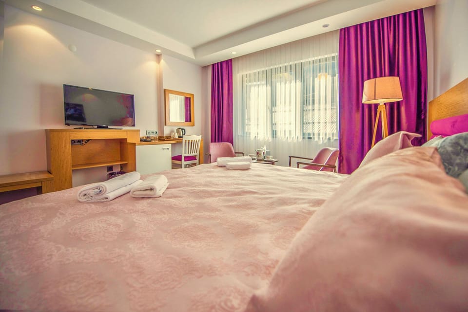 Premium bedding, down comforters, memory foam beds, minibar