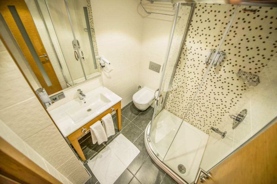 Shower, rainfall showerhead, designer toiletries, hair dryer