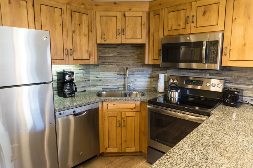 Condo, 1 Bedroom | Private kitchen | Full-size fridge, microwave, oven, stovetop