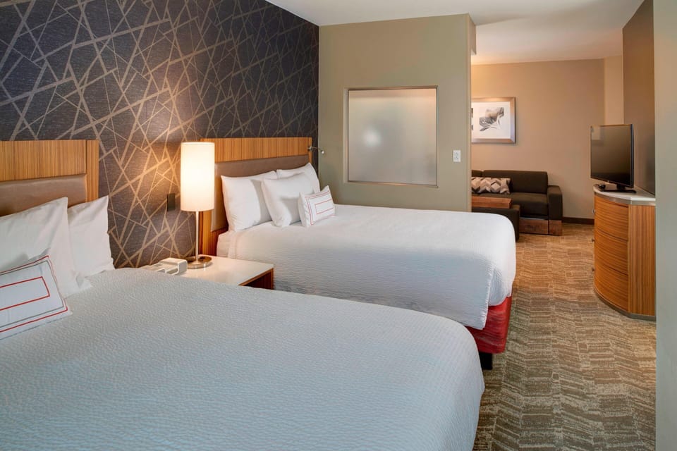 Pillowtop beds, desk, laptop workspace, blackout drapes