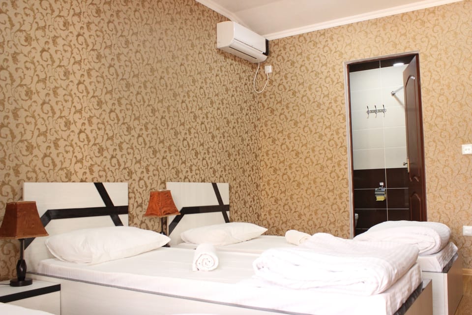 Standard Triple Room, City View | 1 bedroom, in-room safe, desk, soundproofing