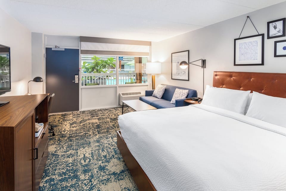 Room, 1 King Bed with Sofa bed, Pool View | Desk, iron/ironing board, cribs (free), WiFi (free)